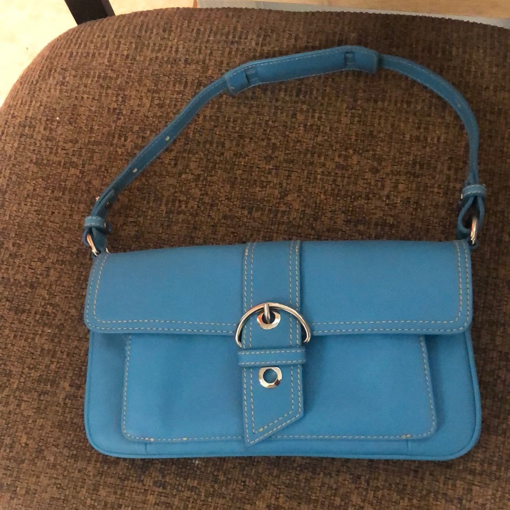 Nice small shoulder bag excellent condition with multiple pockets .